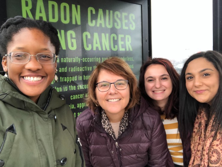 Chrysan Cronin, professor and director of public health, poses with students who are part of a public health research group.